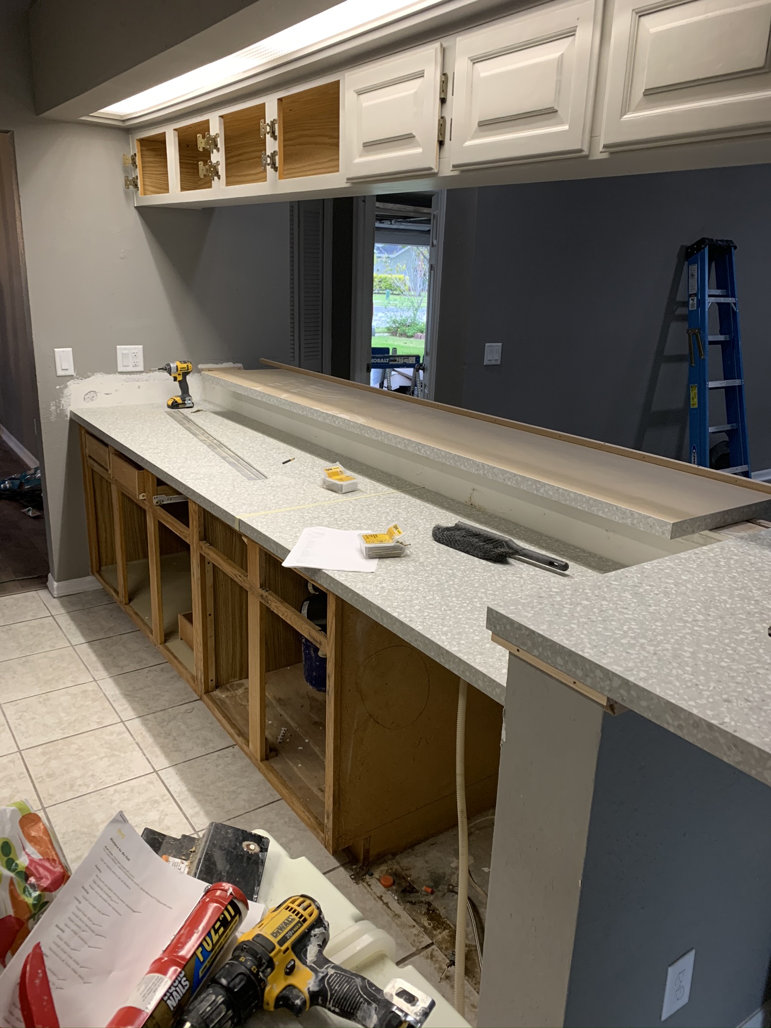 Remodeled kitchen with new cabinetry and countertops by Wise Gies Construction